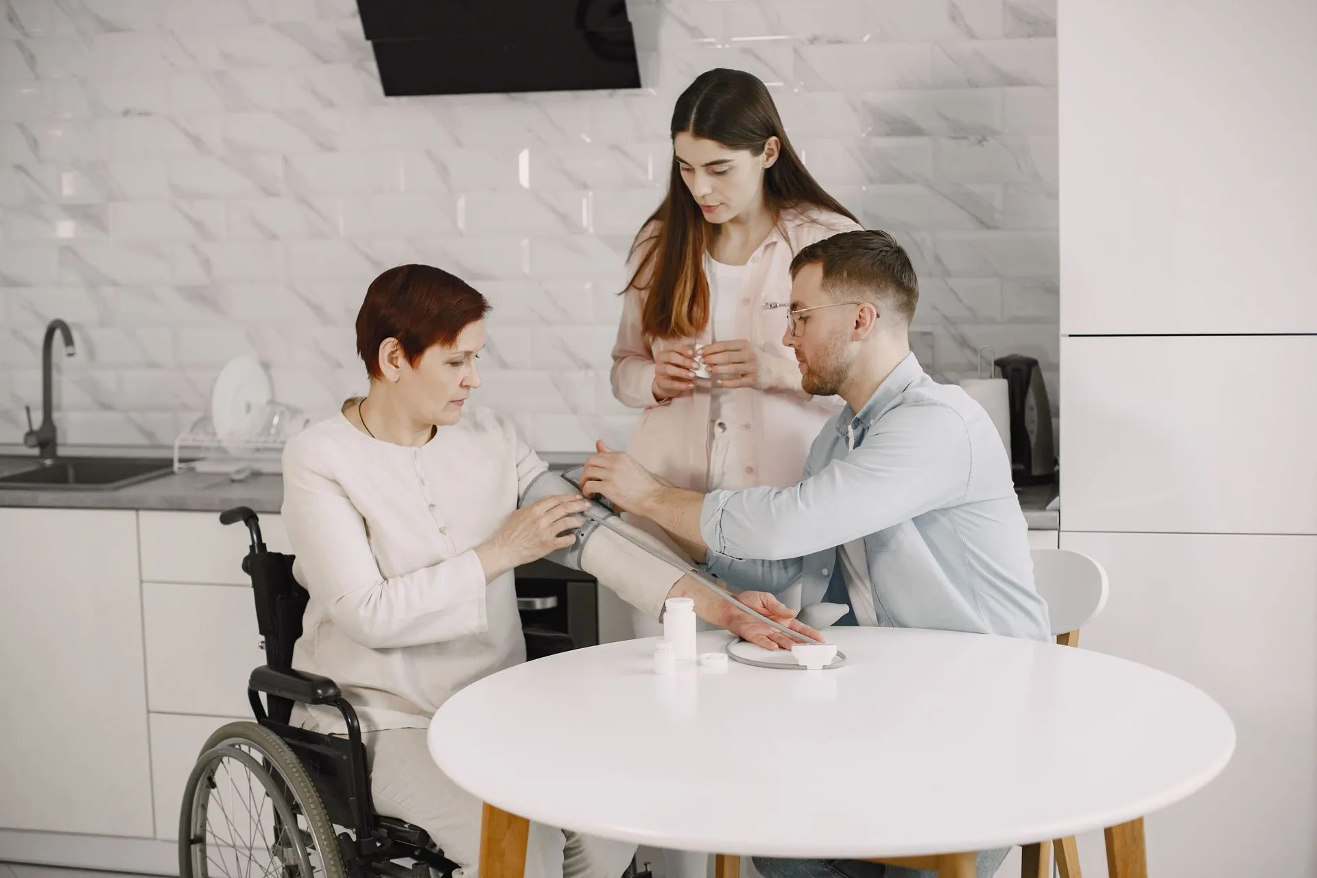 A caregiver checking a patient’s blood pressure at home